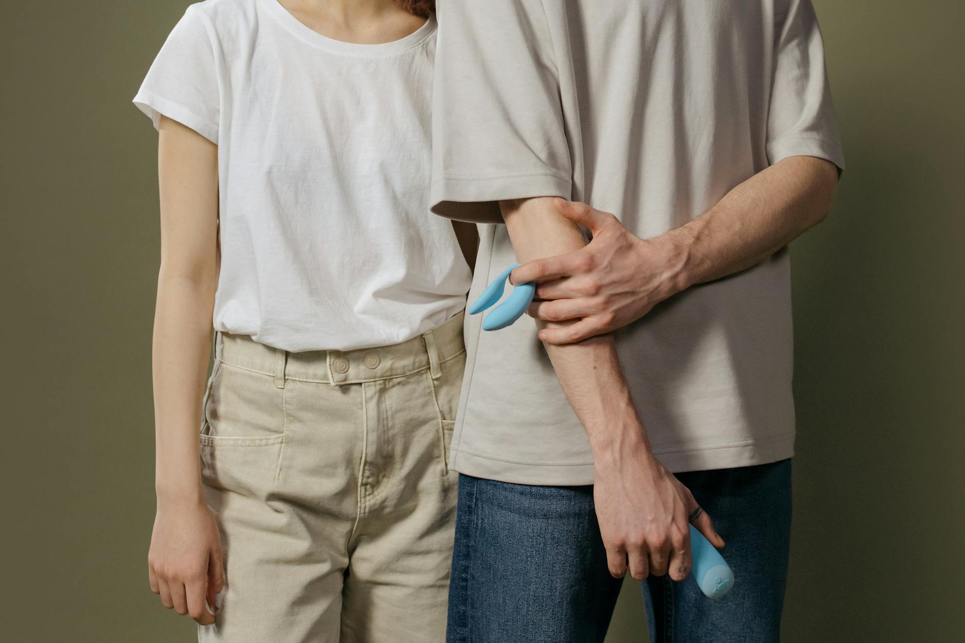 A couple standing together indoors, representing intimate connection during postpartum recovery